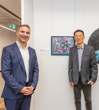 Mayor John Faker with Artwork of the Year Winner Fan Dongwang, 'Pandemic Body'