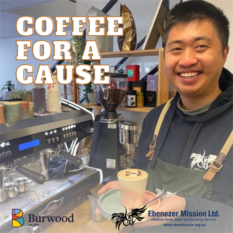 Man wearing an apron, smiling holding a freshly made coffee with the words Coffee for a Cause in bold