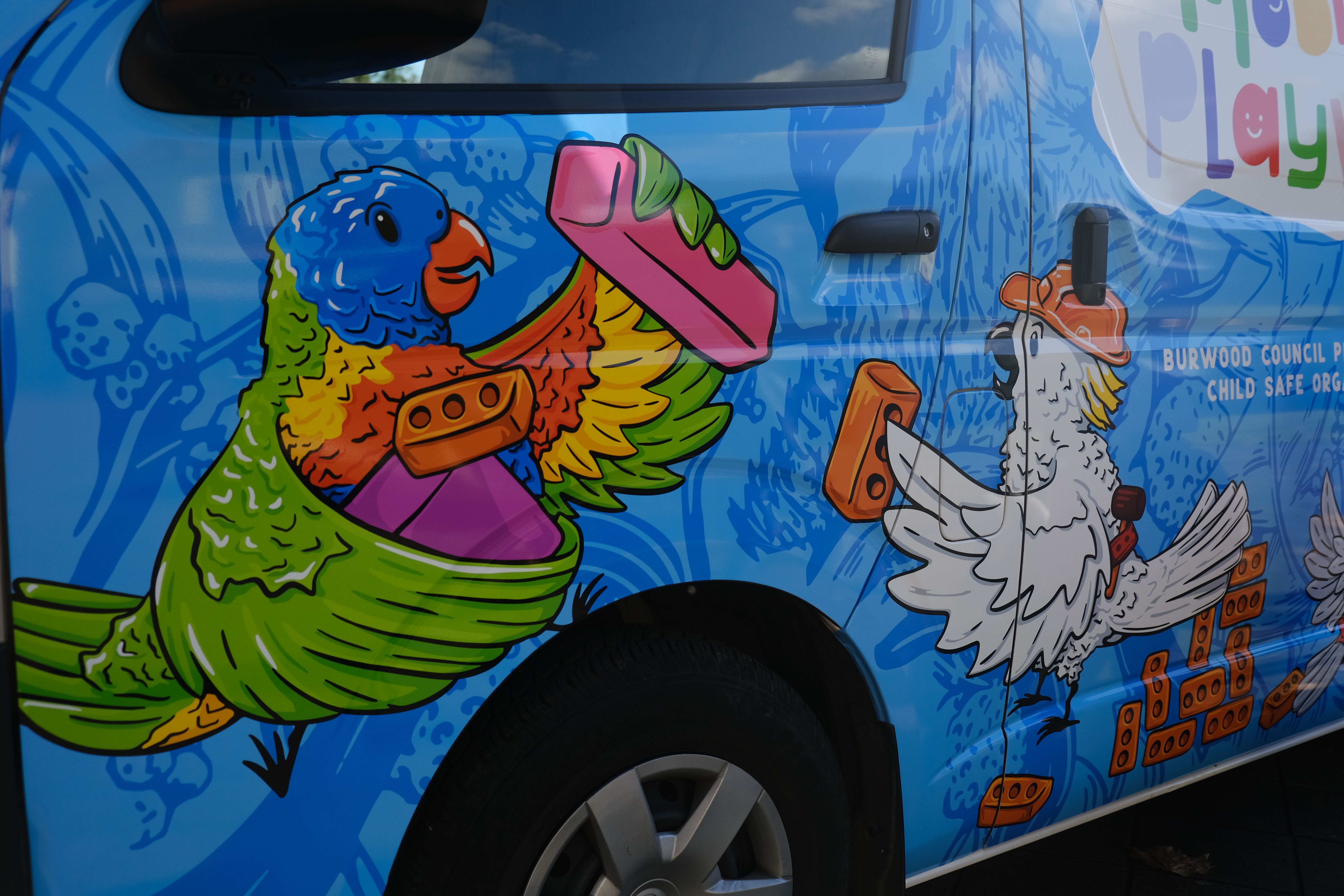 A close up look at colourful Australian animal themed illustrations on a van
