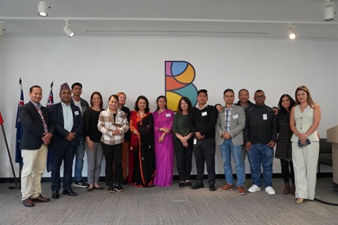 15 people stood next to each other representing the Nepalese community forum group for Burwood