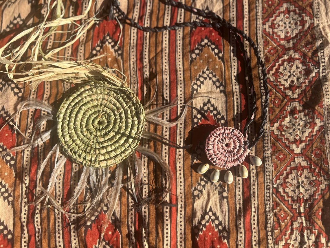 Aboriginal weavings on a fabric background