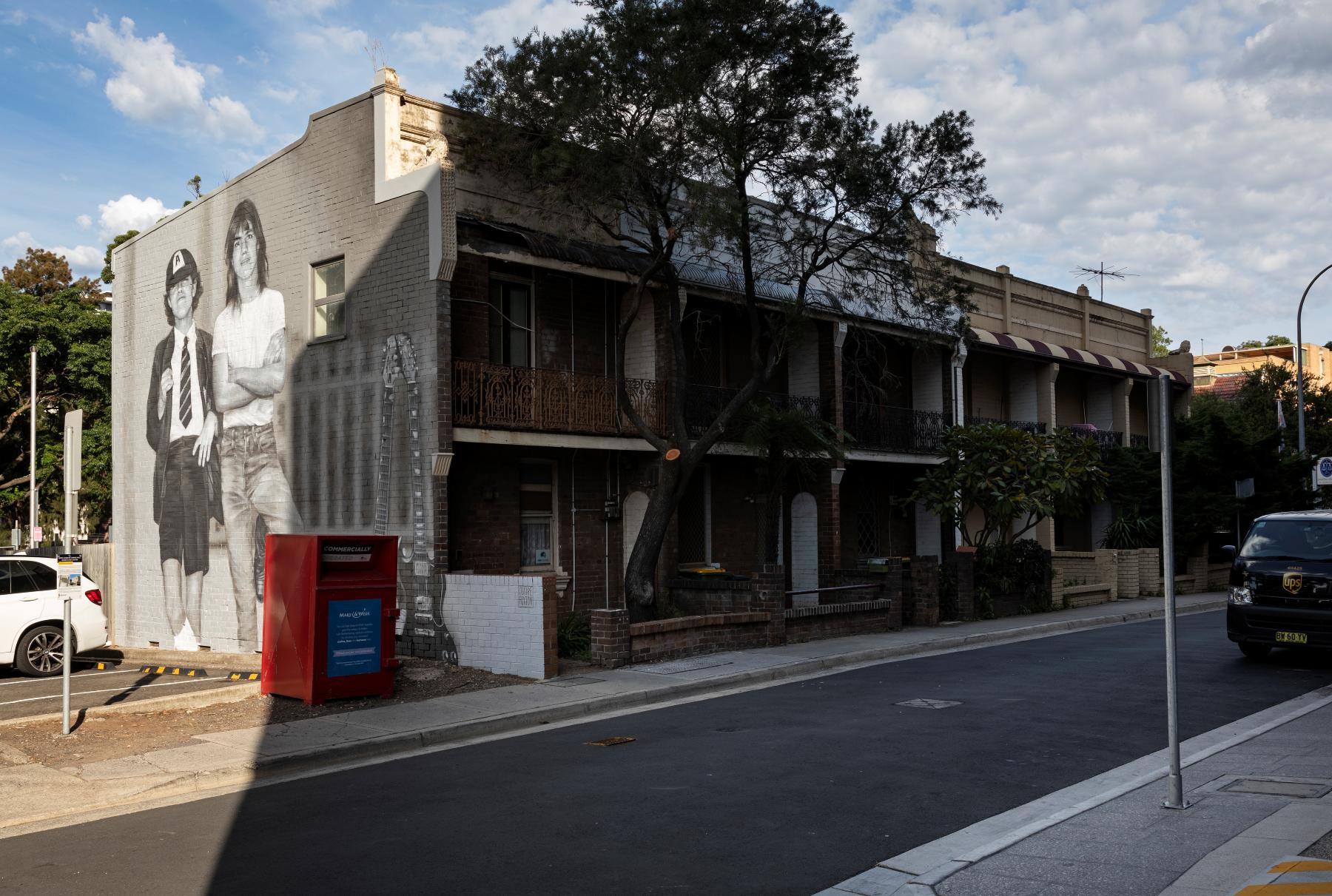 a mural dedicated to Angus and Malcolm Young from Australian rock band AC/DC. Located on the side of 12 Burleigh Street, Burwood