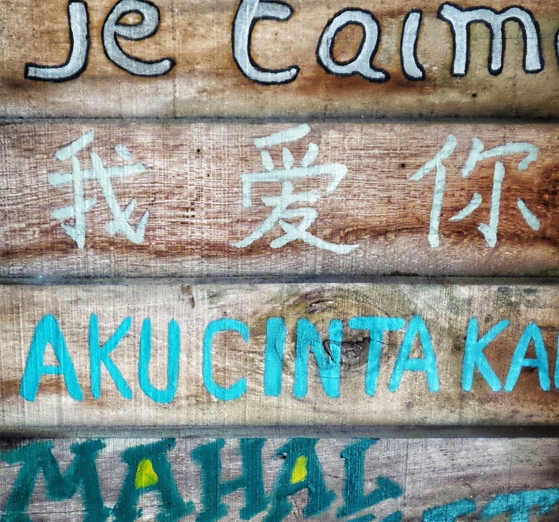 I love you in different languages on wooden board