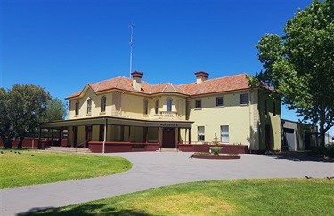 Photo of Woodstock building with fountain area and path