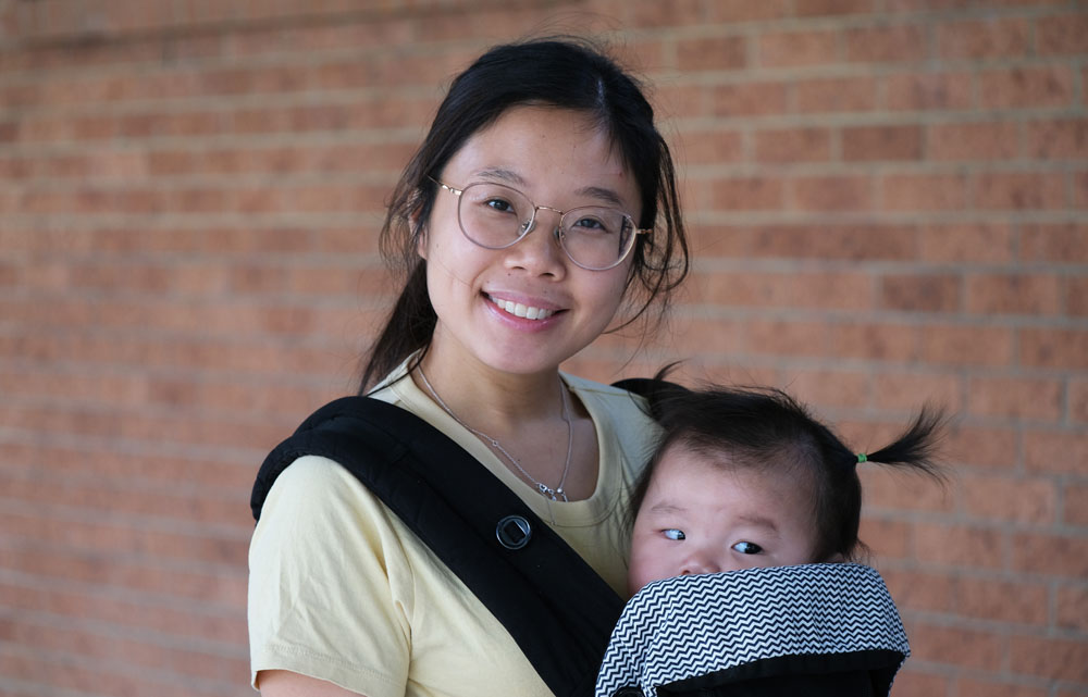 local community member Alice with her baby